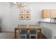 Dining area with chandelier and adjacent kitchen at 1256 S Beach Cir, Kissimmee, FL 34746