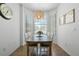 Bright dining room with a wood table and built-in window seat at 1256 S Beach Cir, Kissimmee, FL 34746