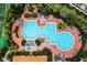 Resort-style pool with surrounding lounge chairs and lush landscaping at 1256 S Beach Cir, Kissimmee, FL 34746