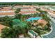 Community aerial view, featuring pool, tennis courts, and numerous townhouses at 1256 S Beach Cir, Kissimmee, FL 34746