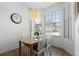 Bright breakfast nook with wood table and window seating at 1256 S Beach Cir, Kissimmee, FL 34746