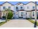 Two story townhome with front yard and driveway at 1256 S Beach Cir, Kissimmee, FL 34746