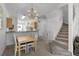 Dining area with chandelier and adjacent kitchen at 1256 S Beach Cir, Kissimmee, FL 34746