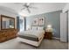 Spacious bedroom with a queen-size bed and lots of natural light at 1256 S Beach Cir, Kissimmee, FL 34746