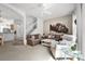 Living room with comfy seating, a coffee table, and a large picture at 1256 S Beach Cir, Kissimmee, FL 34746