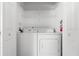 Laundry closet with washer and dryer; stacked neatly at 1256 S Beach Cir, Kissimmee, FL 34746
