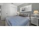Bright bedroom with double bed, nightstands, and ample closet space at 1256 S Beach Cir, Kissimmee, FL 34746
