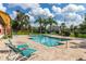 Refreshing community pool with plenty of lounge chairs at 4524 Commander Dr # 1634, Orlando, FL 32822