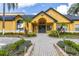 Community building with gray doors and nicely landscaped grounds at 4524 Commander Dr # 1634, Orlando, FL 32822