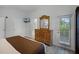 Bright bedroom with a dresser, TV and private door access at 306 Lucaya Loop # B5/U306, Davenport, FL 33897