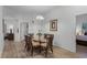 Bright dining room with glass table, wicker chairs, and hardwood floors at 306 Lucaya Loop # B5/U306, Davenport, FL 33897