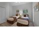 Bedroom with two twin beds, dresser, and private door access at 306 Lucaya Loop # B5/U306, Davenport, FL 33897