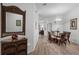 Bright dining room featuring a glass-top table, wicker chairs, and hardwood floors at 306 Lucaya Loop # B5/U306, Davenport, FL 33897