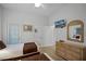 Bedroom with two twin beds, dresser, and access to bathroom at 306 Lucaya Loop # B5/U306, Davenport, FL 33897