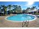 Resort-style community pool with ample lounge chairs at 306 Lucaya Loop # B5/U306, Davenport, FL 33897
