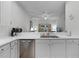 Kitchen with stainless steel dishwasher and view of living room at 306 Lucaya Loop # B5/U306, Davenport, FL 33897