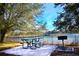 Relaxing lakeside picnic area with table, grill and scenic views at 306 Lucaya Loop # B5/U306, Davenport, FL 33897