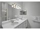 Double vanity bathroom with a large mirror and shower at 306 Lucaya Loop # B5/U306, Davenport, FL 33897