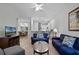 Open concept living room with view of dining room and kitchen at 306 Lucaya Loop # B5/U306, Davenport, FL 33897