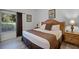 King-size bed with dresser and view of backyard at 306 Lucaya Loop # B5/U306, Davenport, FL 33897