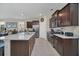 Kitchen with stainless steel appliances and granite countertops at 7535 Oakmoss Loop, Davenport, FL 33837