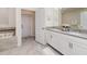 Main bathroom with double vanity, soaking tub, and separate shower at 1676 Moon Valley Dr, Davenport, FL 33896