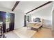 Main bedroom with a queen-size bed and large windows at 4350 E Hinson Ave, Haines City, FL 33844