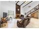 Spacious living room with a fireplace and leather furniture at 4350 E Hinson Ave, Haines City, FL 33844