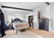 Bright bedroom with a double bed, dresser, and walk-in closet at 4350 E Hinson Ave, Haines City, FL 33844
