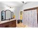 Bathroom with double vanity, granite countertop, and shower at 4350 E Hinson Ave, Haines City, FL 33844