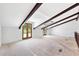Large loft area with exposed beams and access to balcony at 4350 E Hinson Ave, Haines City, FL 33844
