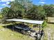 Covered boat storage area with boat and other equipment at 4350 E Hinson Ave, Haines City, FL 33844