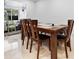Bright dining room with a large wooden table and six chairs at 4350 E Hinson Ave, Haines City, FL 33844