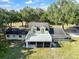 Aerial view of a two story house with large deck and yard at 4350 E Hinson Ave, Haines City, FL 33844