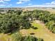 Aerial view of property showcasing house, expansive yard, and surrounding landscape at 4350 E Hinson Ave, Haines City, FL 33844