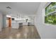 Open concept kitchen with white cabinets and island at 424 Wilder Rd, Lakeland, FL 33809