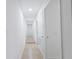Clean and bright hallway with tile floors and neutral walls at 424 Wilder Rd, Lakeland, FL 33809