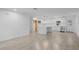 Open concept kitchen boasts white cabinets, stainless steel appliances, and tile floors at 424 Wilder Rd, Lakeland, FL 33809
