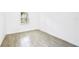 Bright bedroom with wood-look floors and a window at 424 Wilder Rd, Lakeland, FL 33809
