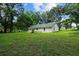 View of the back of the house and expansive yard at 424 Wilder Rd, Lakeland, FL 33809