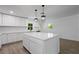Modern kitchen with white cabinets and island at 424 Wilder Rd, Lakeland, FL 33809