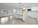 Bright kitchen features white shaker cabinets, quartz countertops, and an island at 424 Wilder Rd, Lakeland, FL 33809