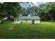 Back of house, showcasing a large backyard at 424 Wilder Rd, Lakeland, FL 33809