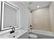 Modern bathroom with a large vanity, a bathtub, and stylish tile at 424 Wilder Rd, Lakeland, FL 33809