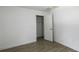 Spacious bedroom with neutral walls, wood-look tile floors, and a large closet at 424 Wilder Rd, Lakeland, FL 33809