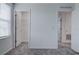 Bright bedroom with grey carpet, closet, and adjacent bathroom at 1928 Rock Maple Bnd, Kissimmee, FL 34746