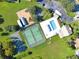 Aerial view showing tennis and basketball courts, playground, and pool at 5232 Deer Creek Dr, Orlando, FL 32821