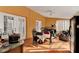Sunroom with table, chairs, and exercise equipment at 5232 Deer Creek Dr, Orlando, FL 32821