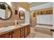 Double vanity bathroom with soaking tub and separate shower at 5232 Deer Creek Dr, Orlando, FL 32821
