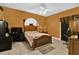 Main bedroom with a wooden bed frame and plenty of space for furniture at 5232 Deer Creek Dr, Orlando, FL 32821